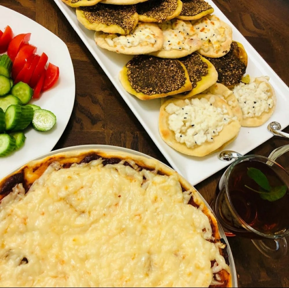 Zaatar and cheese manakish with fresh vegetables